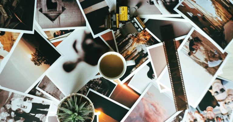 Materials and magazine scrap for a vision board lay on a table.