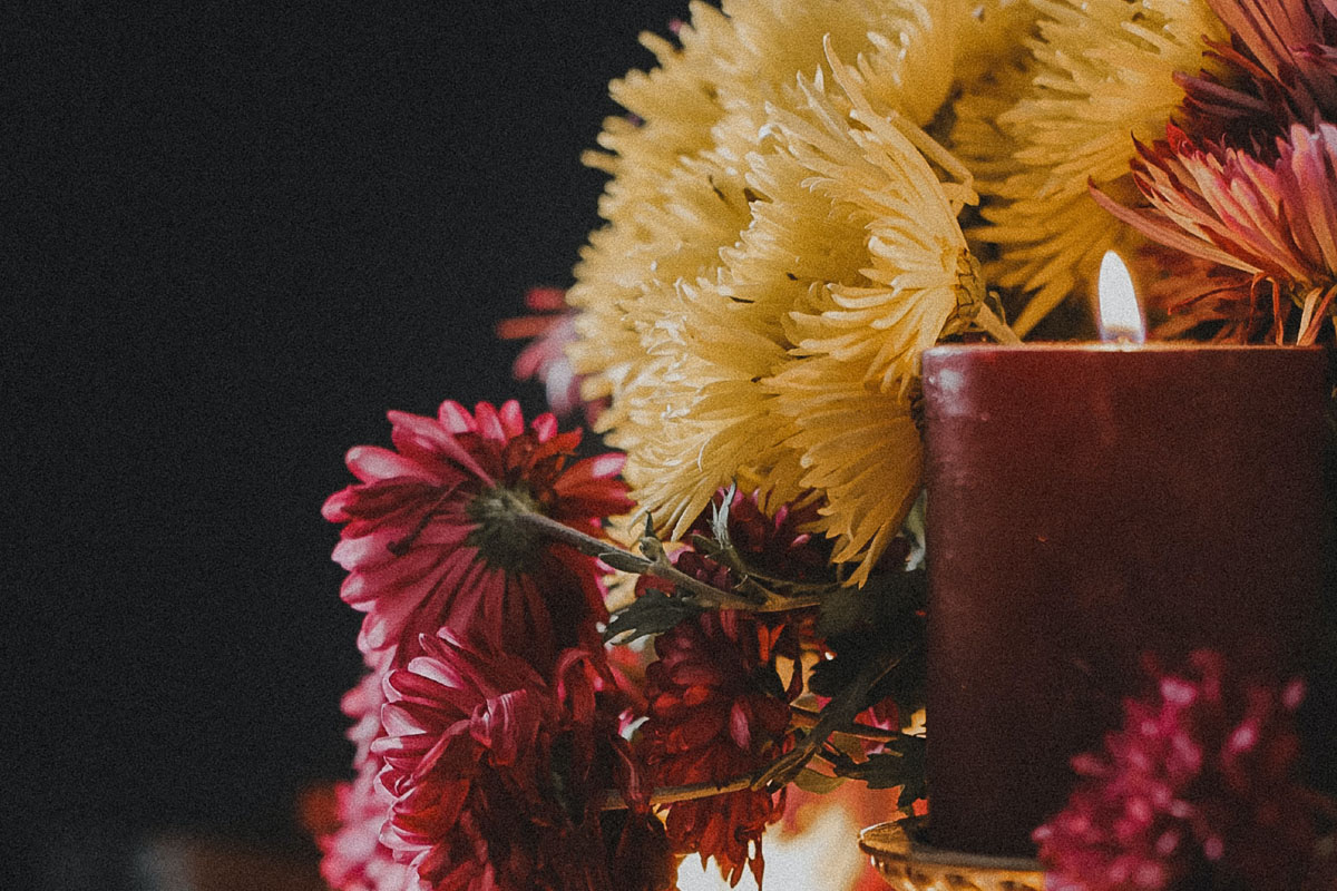 A mabon altar filled with flowers and candles. 