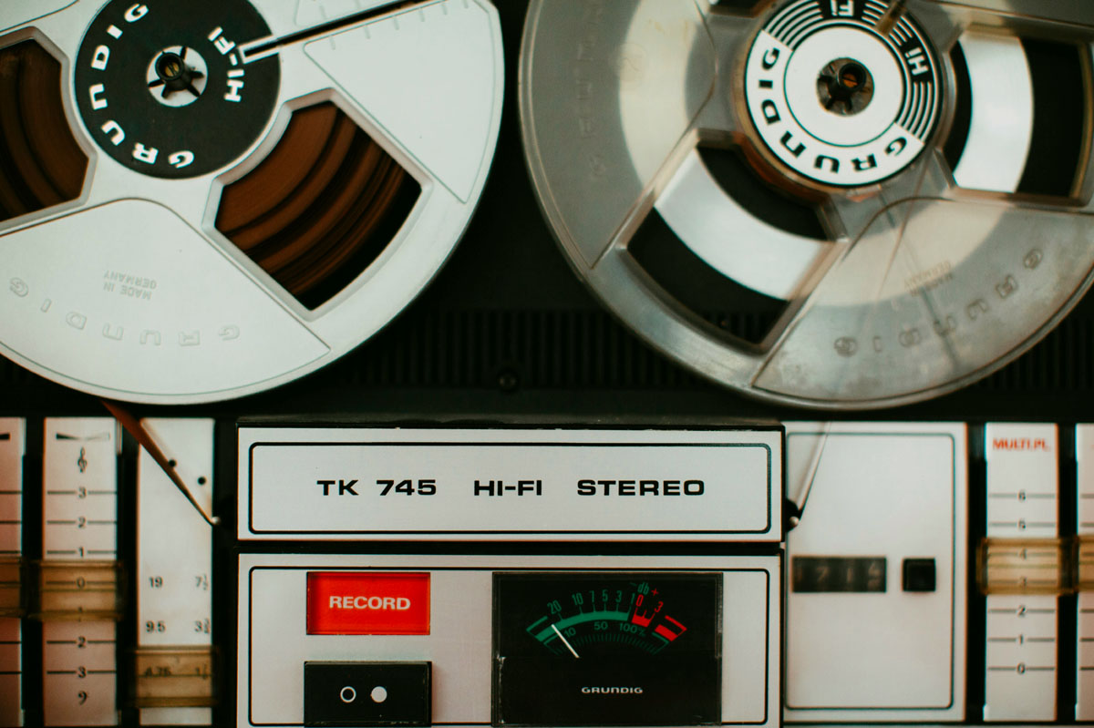 Old video equipment being played in a closeup of a stereo system.