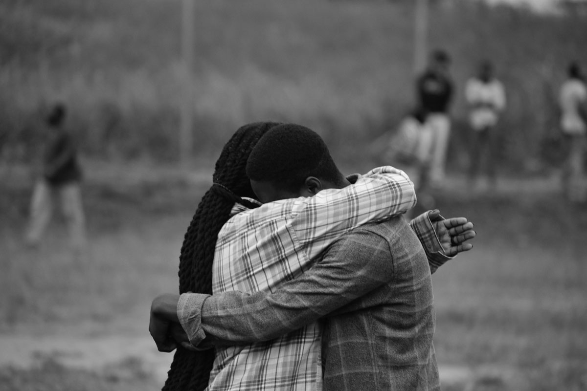 A couple embrace in a strong relationship.