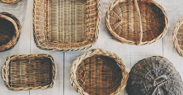 Baskets lay on a white table.